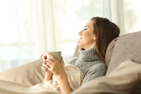 A woman relaxing on the couch.